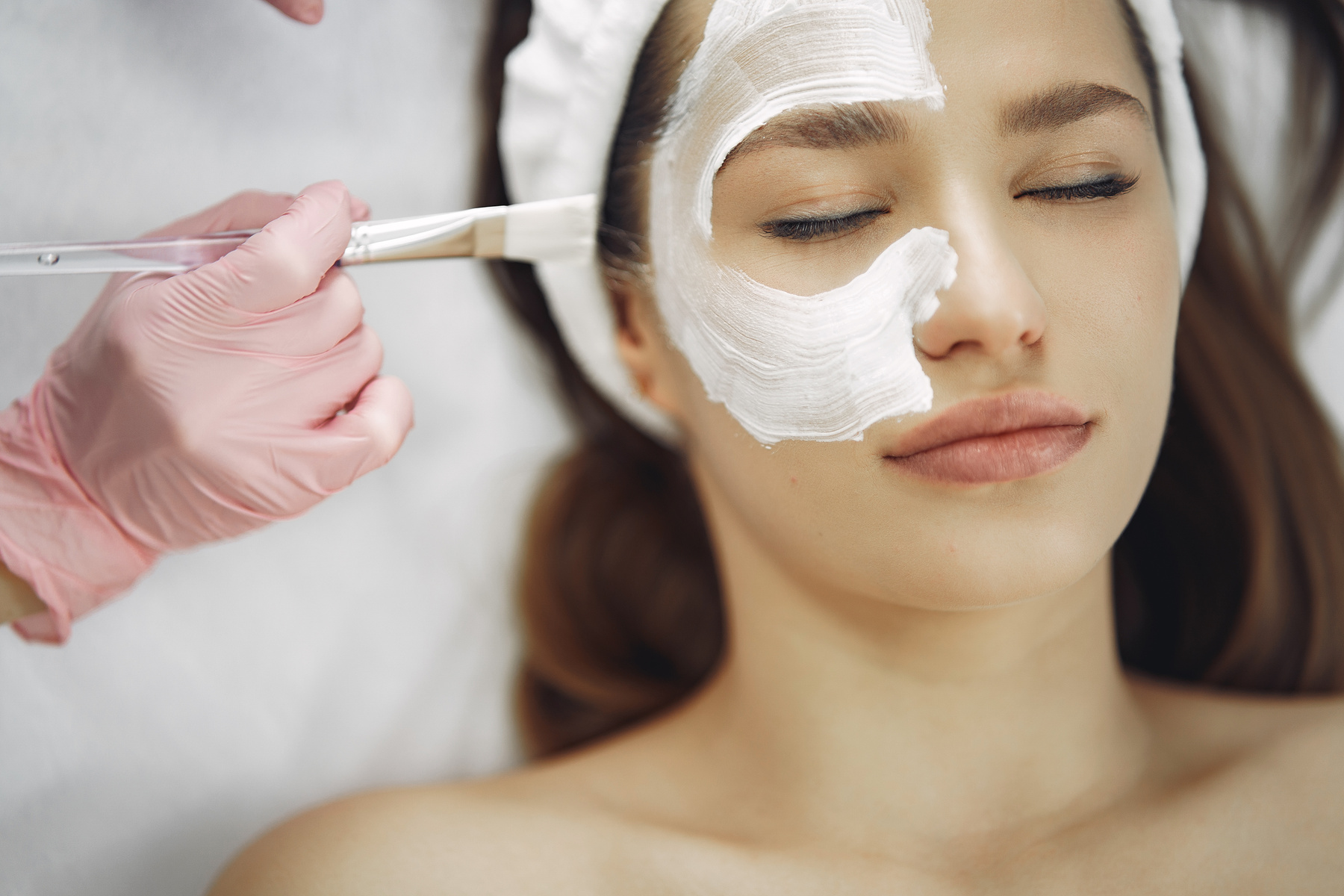 Woman With White Facial Mask